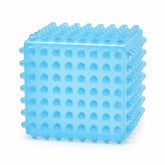 SensoFlex sensory squeeze cube toy in bright green; pink SensoFlex anti-stress squeeze cube on display stand; blue textured squeeze cube sensory toy; SensoFlex squeeze cube held in hand; textured sensory cube toy with raised bumps; pink blue and bright green SensoFlex squeeze cubes; anti-stress squeeze cube display of 12; SensoFlex tactile fidget toy