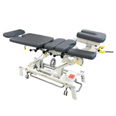 Chiropractic Table Electric chiropractic table with drop sections Chiropractic table with traction features FairWorth table with adjustable headrest Heavy-duty steel chiropractic treatment table