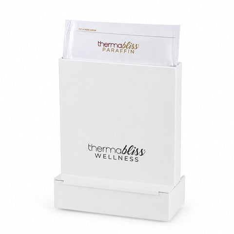 thermabliss Metal Paraffin Heating Chamber; thermabliss metal heating chamber for paraffin gloves and booties; compact vertical thermabliss paraffin heating chamber; metal thermabliss heating chamber in a wellness treatment setting; thermabliss paraffin chamber with compact vertical design; commercial-grade metal paraffin heating chamber; thermabliss heating system using mineral heater pouch and tap water; thermabliss Metal Heating Chamber for client-exclusive paraffin treatments. 