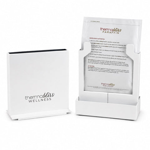 thermabliss Metal Paraffin Heating Chamber; thermabliss metal heating chamber for paraffin gloves and booties; compact vertical thermabliss paraffin heating chamber; metal thermabliss heating chamber in a wellness treatment setting; thermabliss paraffin chamber with compact vertical design; commercial-grade metal paraffin heating chamber; thermabliss heating system using mineral heater pouch and tap water; thermabliss Metal Heating Chamber for client-exclusive paraffin treatments. 