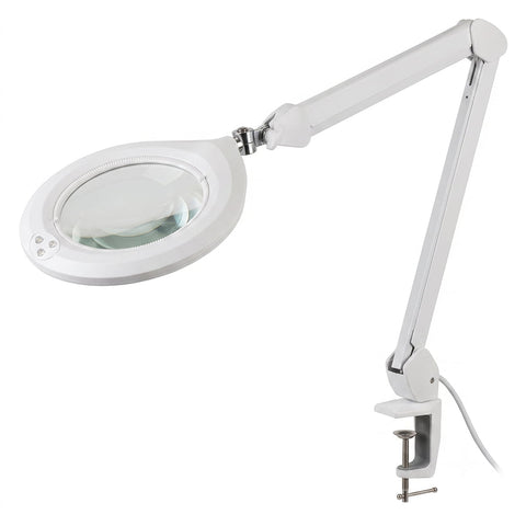 Silhouet-Tone C103 professional LED magnifying lamp; C103 magnifying lamp with articulated arm; 7-inch glass lens on Silhouet-Tone C103 lamp; LED ring surrounding the C103 magnifying lens; C103 table-clamp magnifying lamp for estheticians; Silhouet-Tone magnifying lamp positioned over a treatment table; Touch dimmer control on C103 LED magnifying lamp; Table clamp attachment for Silhouet-Tone C103 lamp.