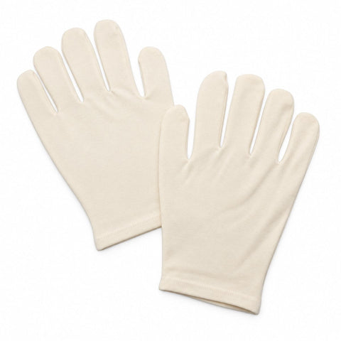 Unbleached cotton moisturizing gloves; reusable cotton gloves for overnight hand care; white cotton moisturizing gloves for use with hand cream; unbleached cotton and elastane hand gloves; moisturizing gloves worn over hand lotion; one-size cotton hand-care gloves; washable cotton gloves for an overnight hand treatment; pair of unbleached cotton moisturizing gloves.